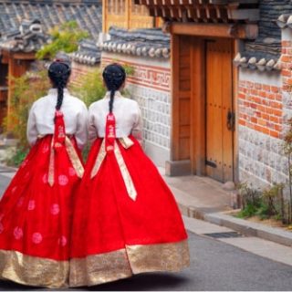 Two women wearing hanbok in Bukchon Hanok Village